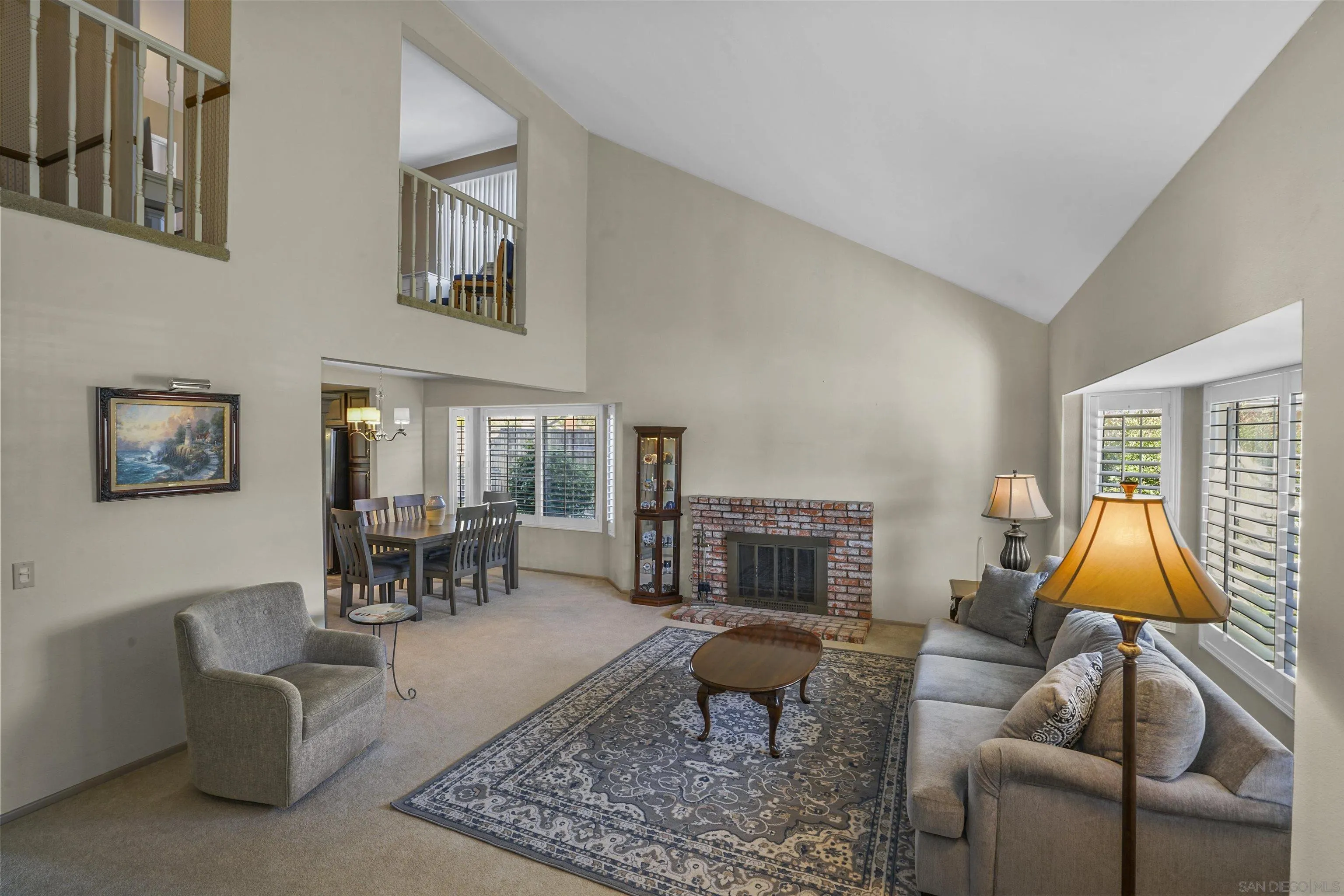 2119 Packard Place El Cajon, CA 92019 - Photo 10 of 29 a living room with furniture a fireplace and a table