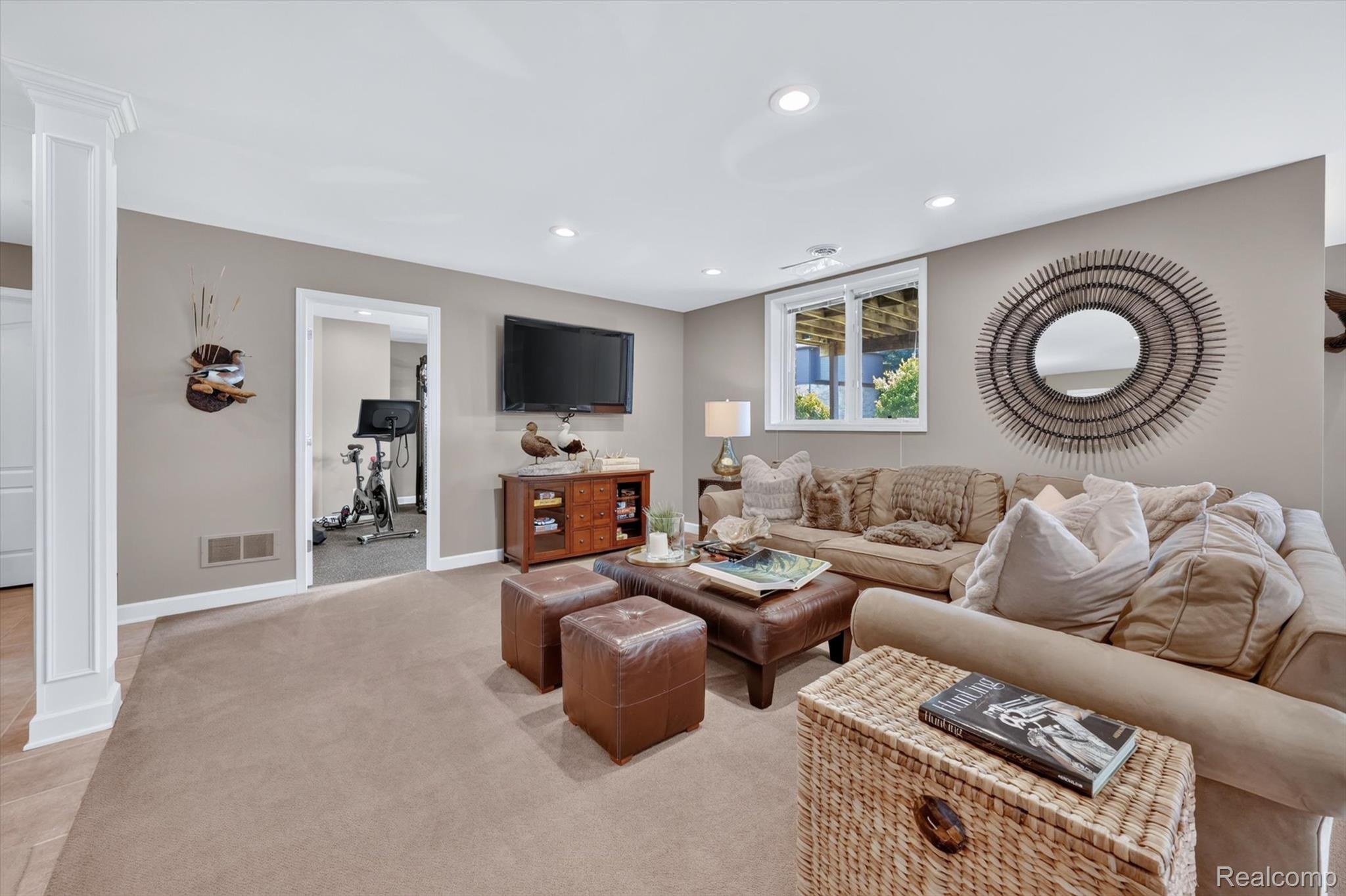 3804 Elk Drive Rochester, MI 48306 - Photo 47 of 75 Carpeted living area featuring recessed lighting, painted walls, a window providing natural light, and a white-trimmed doorway opening to an additional interior space