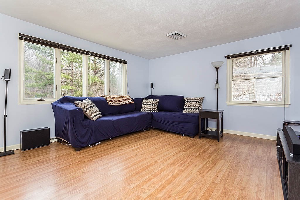 7 Nevada Road Chelmsford, MA 01824 - Photo 11 of 21 a living room with furniture and a large window