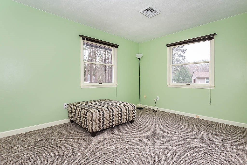 7 Nevada Road Chelmsford, MA 01824 - Photo 14 of 21 a living room with a bed and a window