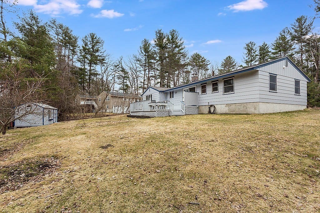 7 Nevada Road Chelmsford, MA 01824 - Photo 20 of 21 a house view with a backyard space
