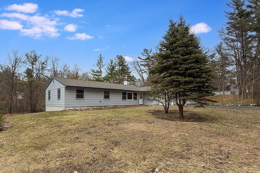 7 Nevada Road Chelmsford, MA 01824 - Photo 21 of 21 a house with trees in the background