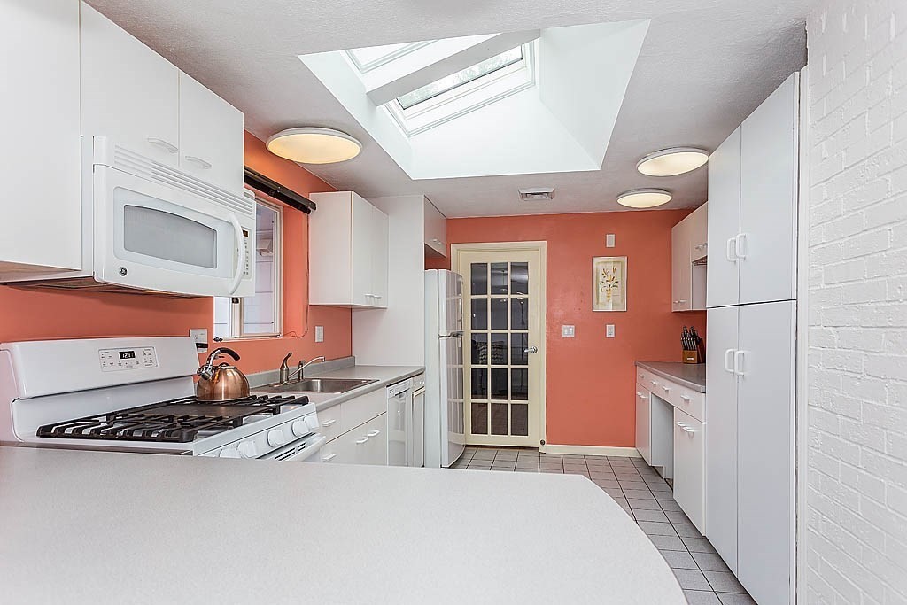 7 Nevada Road Chelmsford, MA 01824 - Photo 8 of 21 a kitchen with stainless steel appliances granite countertop a stove and a refrigerator