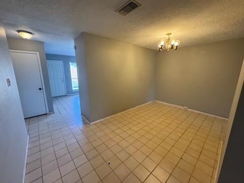 2319 Autumn Springs Lane Spring, TX 77373 - Photo 4 of 14 an empty room with chandelier fan