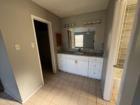 2319 Autumn Springs Lane Spring, TX 77373 - Photo 7 of 14 a bathroom with a granite countertop sink and a mirror