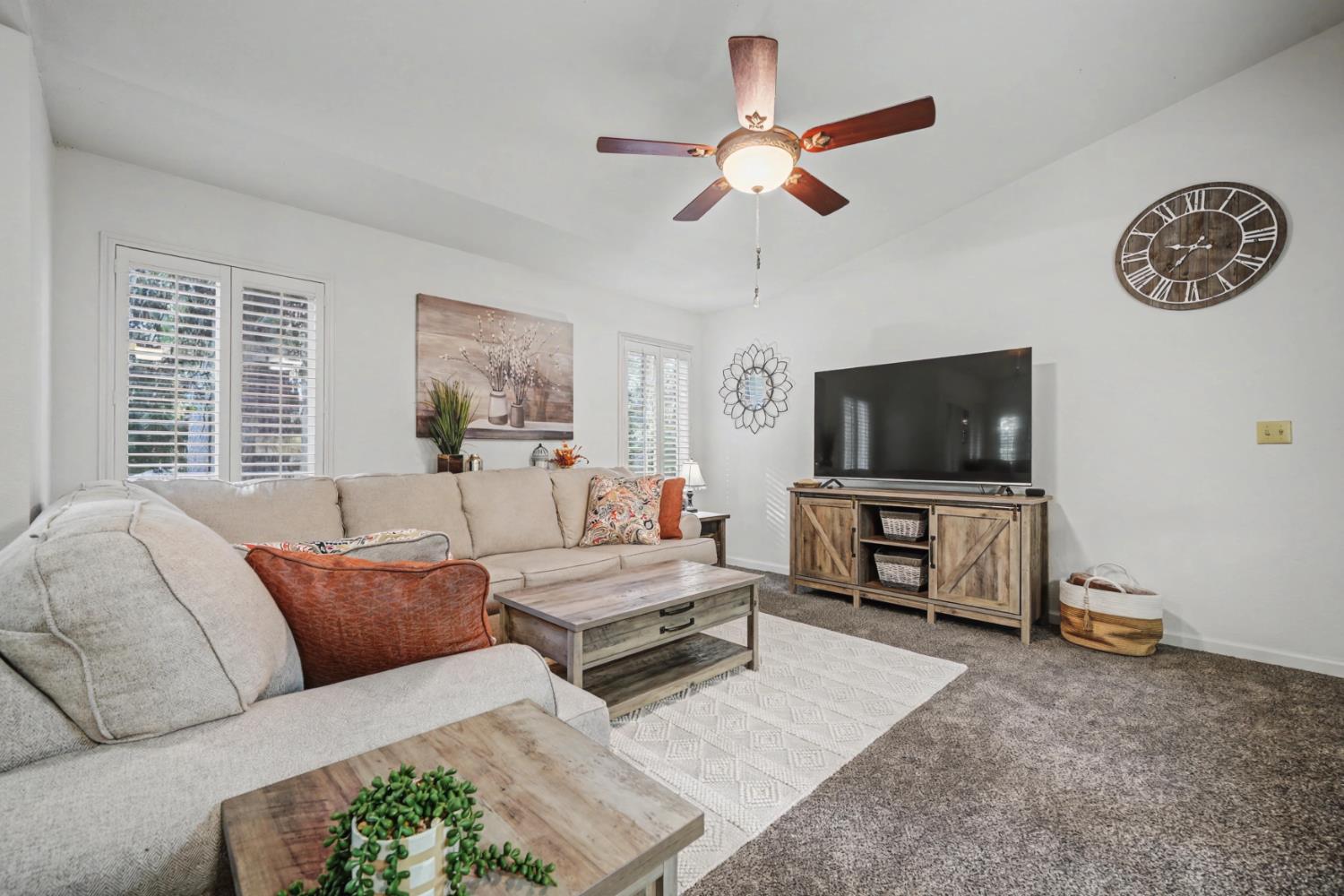 27390 Barton Road Pioneer, CA 95666 - Photo 13 of 52 a living room with furniture and a flat screen tv