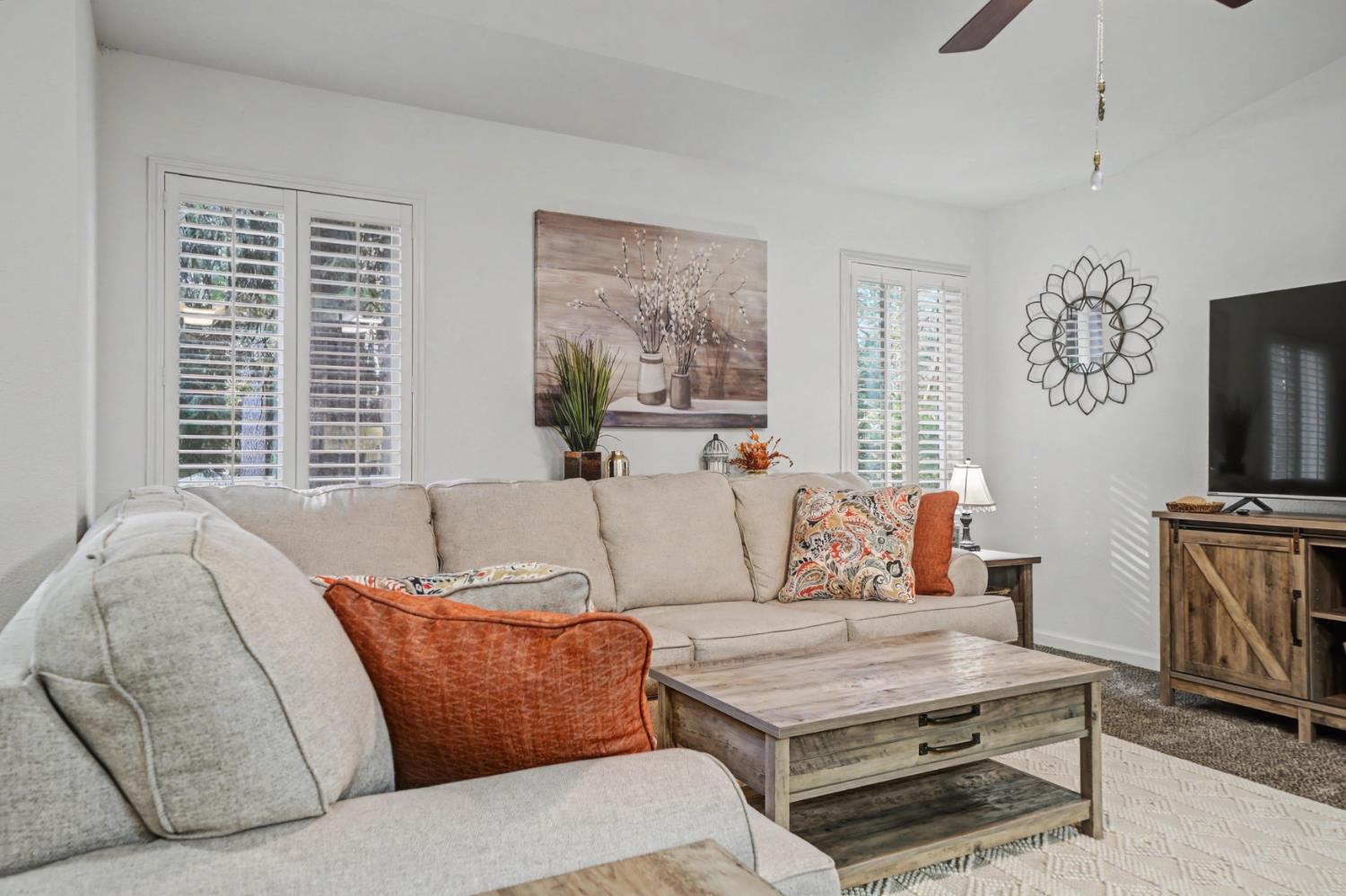 27390 Barton Road Pioneer, CA 95666 - Photo 14 of 52 a living room with furniture a flat screen tv and a window