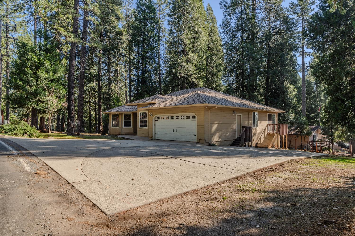 27390 Barton Road Pioneer, CA 95666 - Photo 2 of 52 front view of a house with a yard