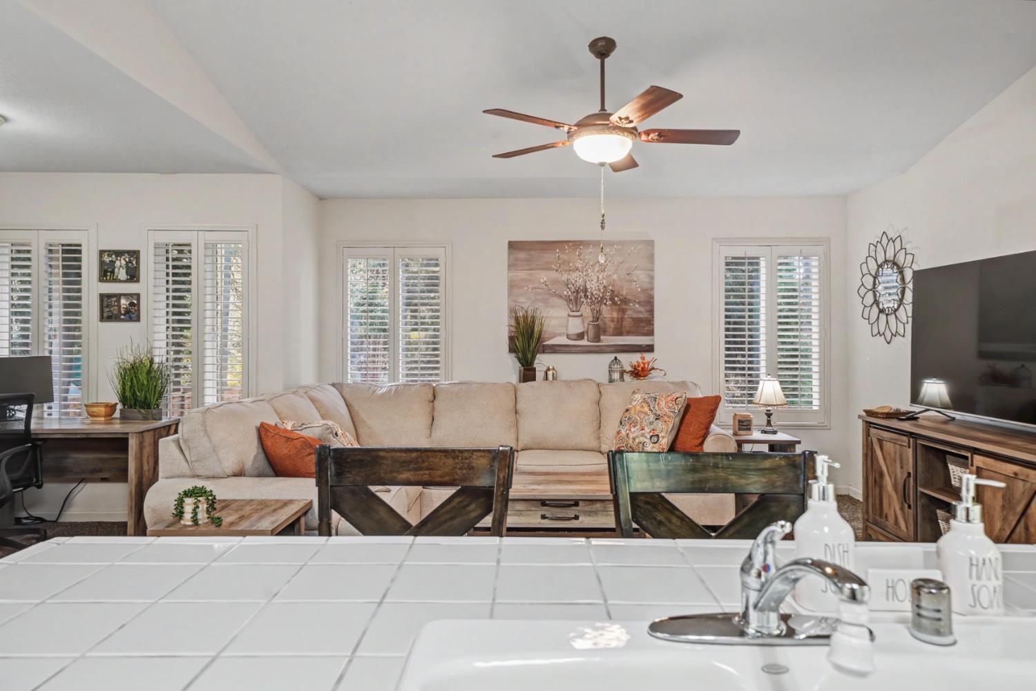 27390 Barton Road Pioneer, CA 95666 - Photo 23 of 52 a living room with fireplace furniture and a flat screen tv