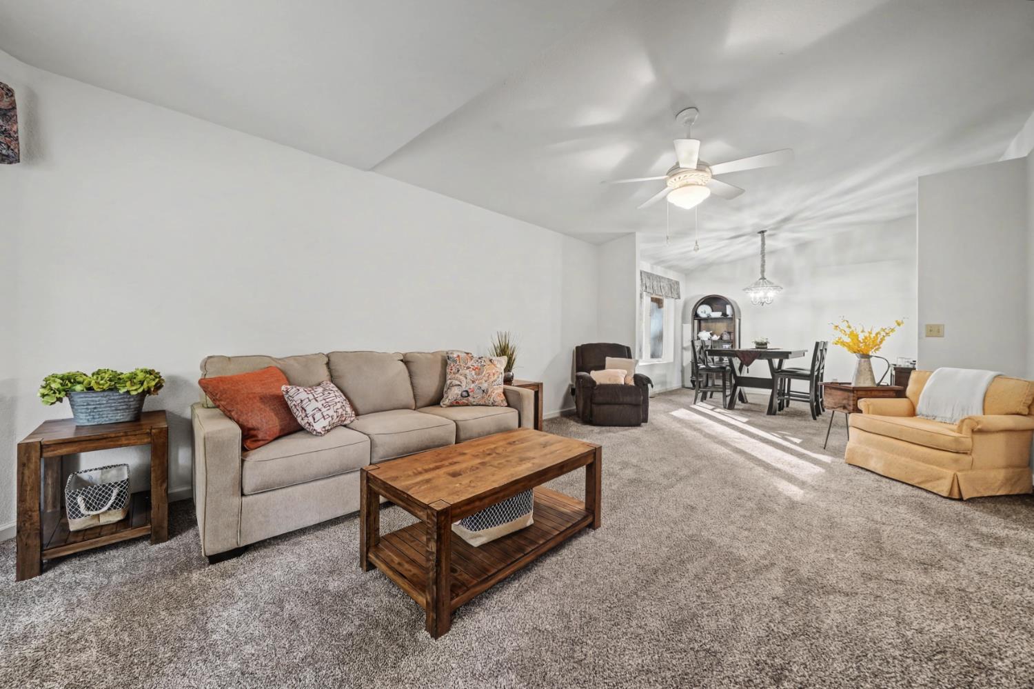 27390 Barton Road Pioneer, CA 95666 - Photo 29 of 52 a living room with furniture and a chandelier