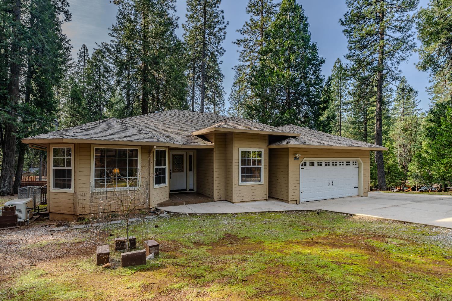 27390 Barton Road Pioneer, CA 95666 - Photo 3 of 52 a view of a house with a yard garage and outdoor seating