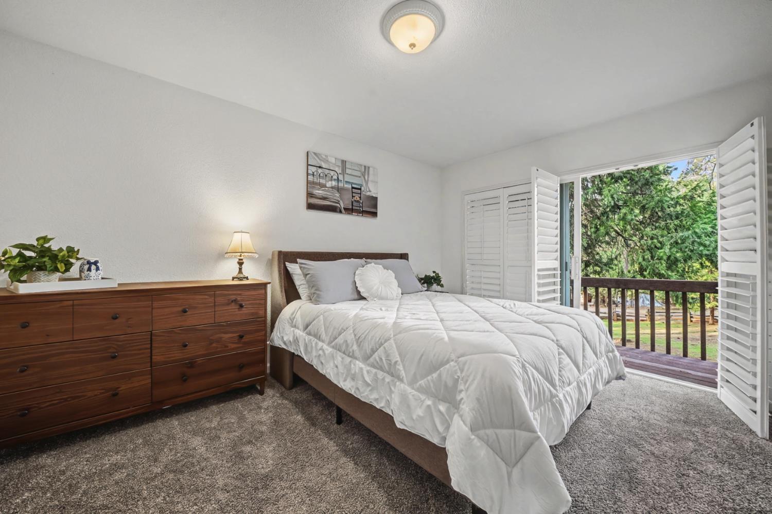 27390 Barton Road Pioneer, CA 95666 - Photo 33 of 52 a bedroom with a bed and a window