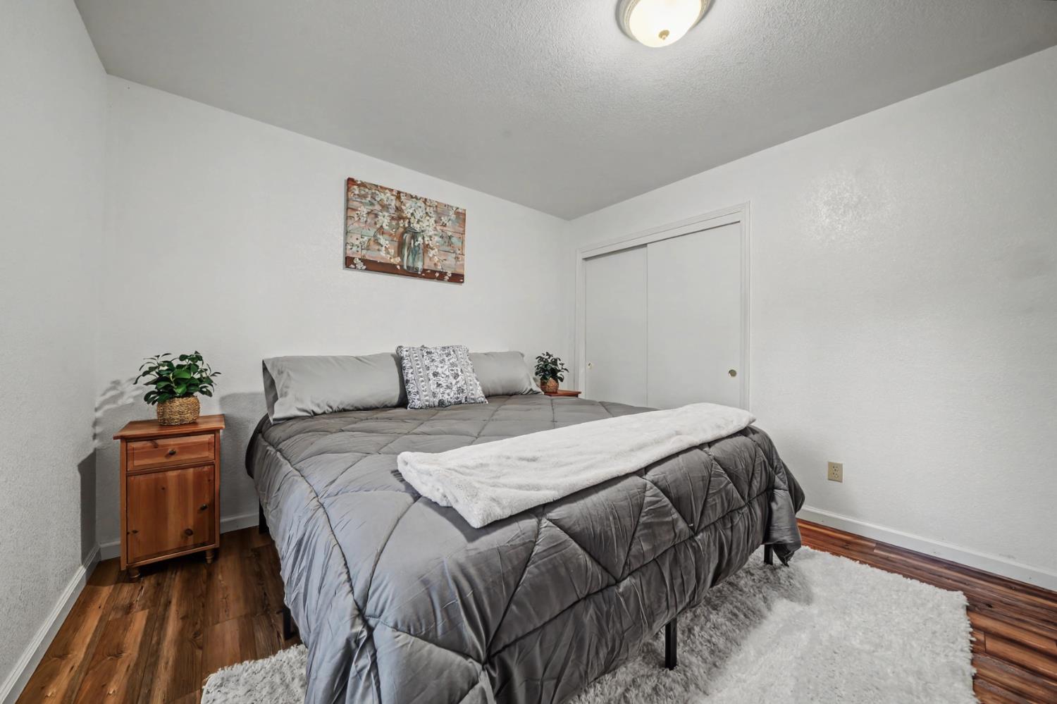 27390 Barton Road Pioneer, CA 95666 - Photo 40 of 52 a bed sitting in a bedroom next to a window