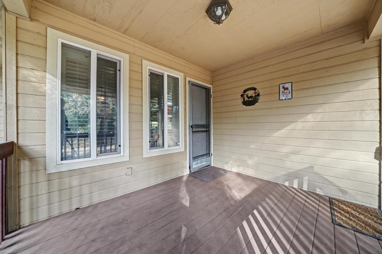 27390 Barton Road Pioneer, CA 95666 - Photo 44 of 52 a view of an empty room with wooden floor and a window