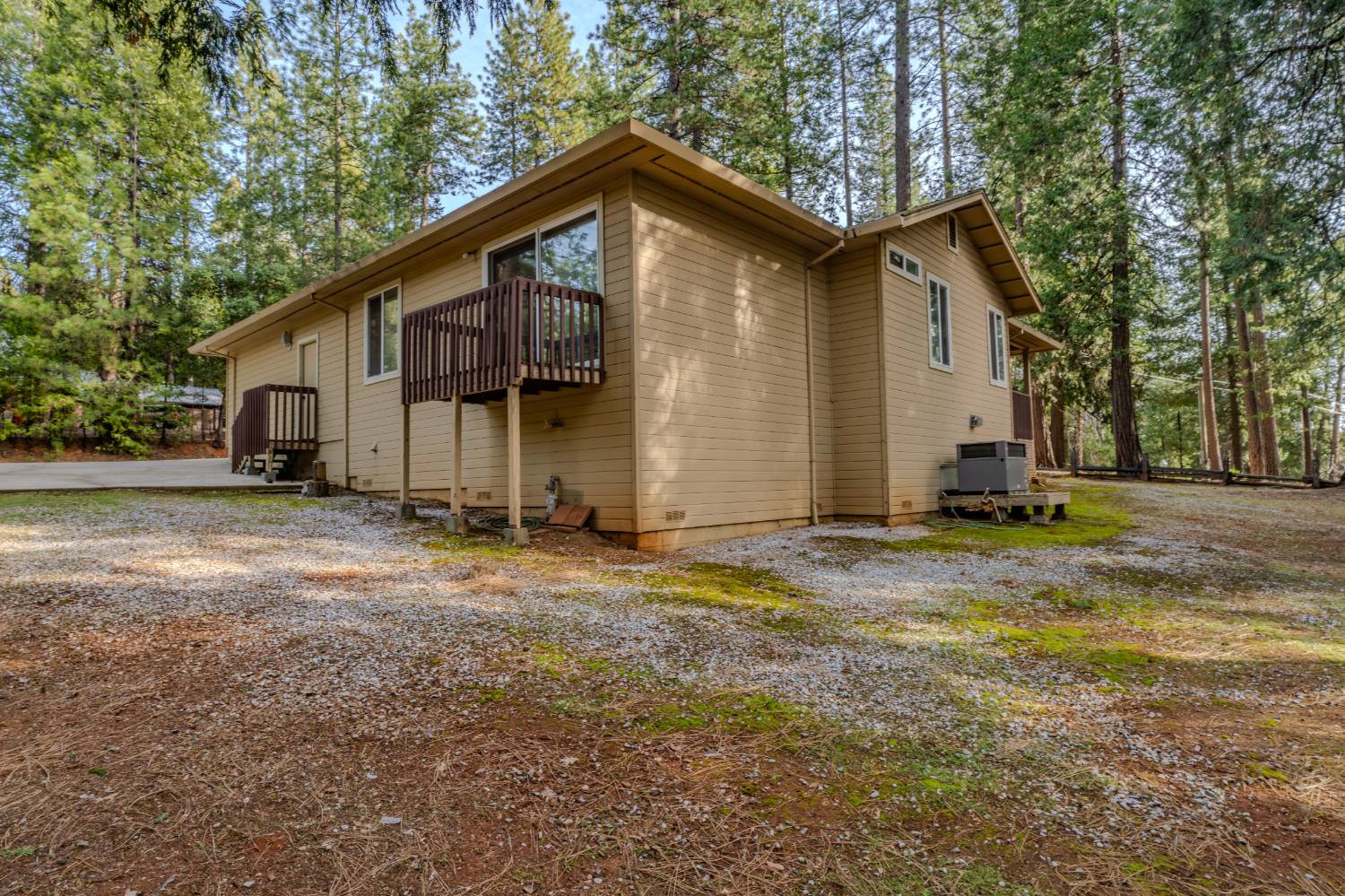 27390 Barton Road Pioneer, CA 95666 - Photo 48 of 52 a front view of a house with a yard