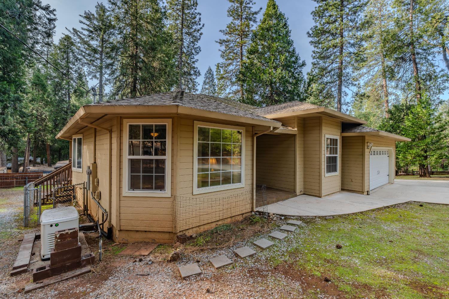 27390 Barton Road Pioneer, CA 95666 - Photo 5 of 52 a front view of a house with a yard