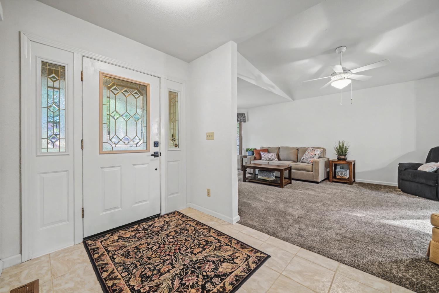 27390 Barton Road Pioneer, CA 95666 - Photo 10 of 52 a living room with furniture and a rug