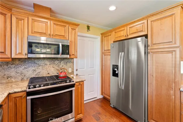 a view of a living room and kitchen