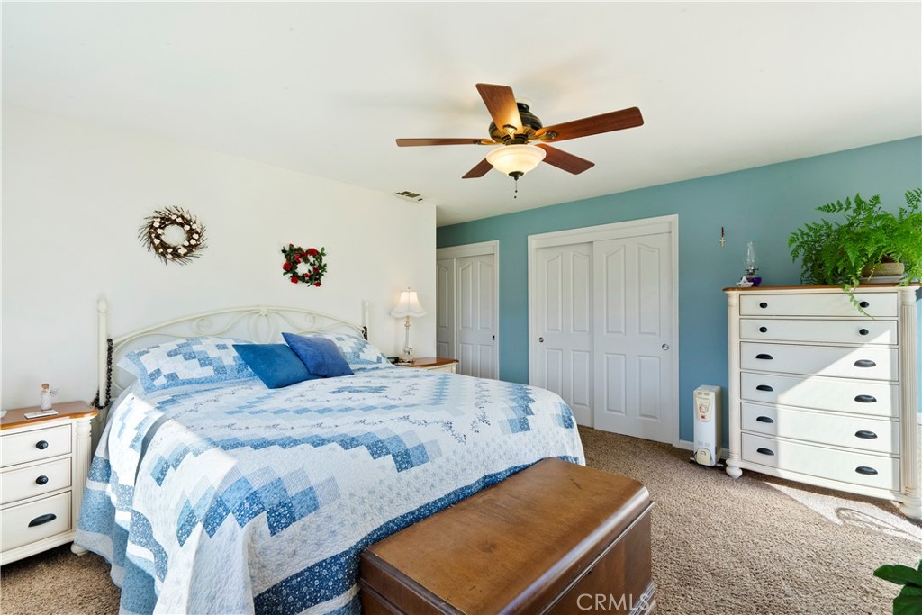 9220 Carmel Road Atascadero, CA 93422 - Photo 24 of 61 The primary bedroom boasts 2 closets and plenty of space to enjoy at the end of the day.