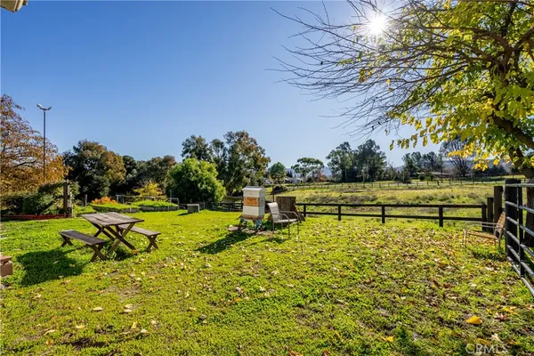a view of a field with ocean view