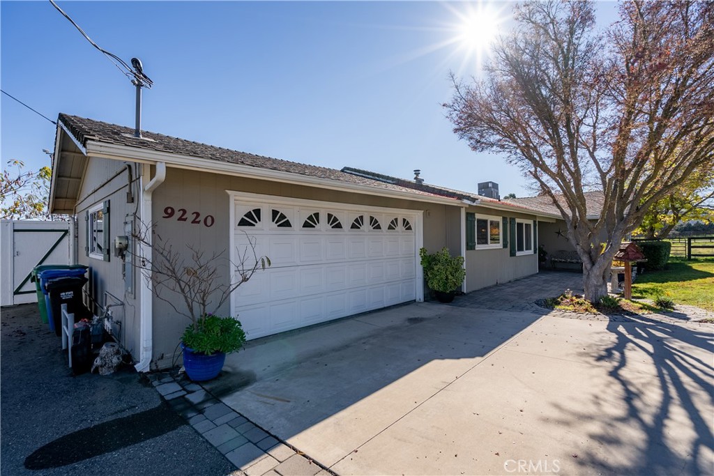 9220 Carmel Road Atascadero, CA 93422 - Photo 4 of 61 The home features an attached 2-car garage with shelving and workbench built in.