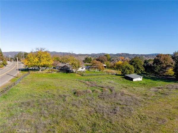 a view of a house with a backyard and a patio