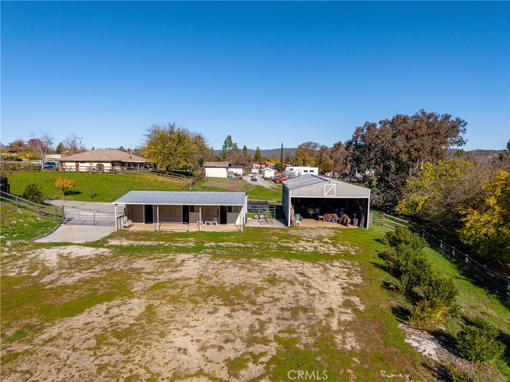 9220 Carmel Road Atascadero, CA 93422 - Photo 46 of 61 The stables and barn share access to the open area which has been used as an arena.