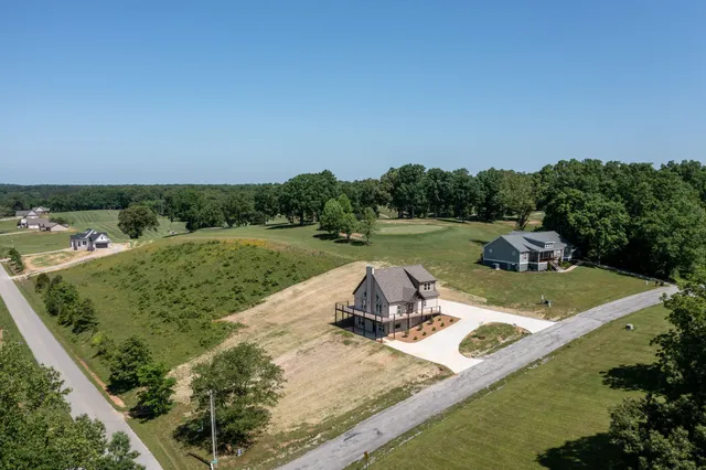 a view of a lake with a yard