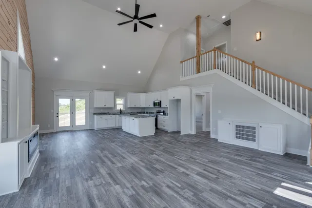 a bathroom with a sink a vanity and a large mirror