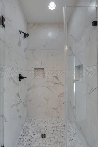 a view of an empty room and wooden floor