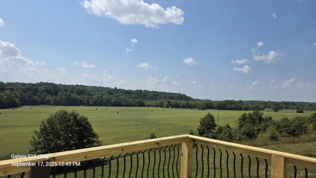 a view of a balcony with wooden floor