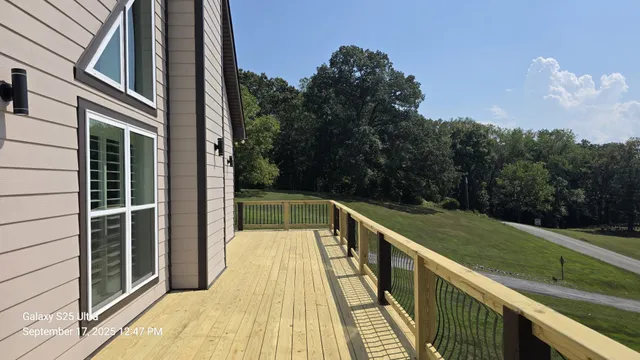 a view of a lake with a house in the background