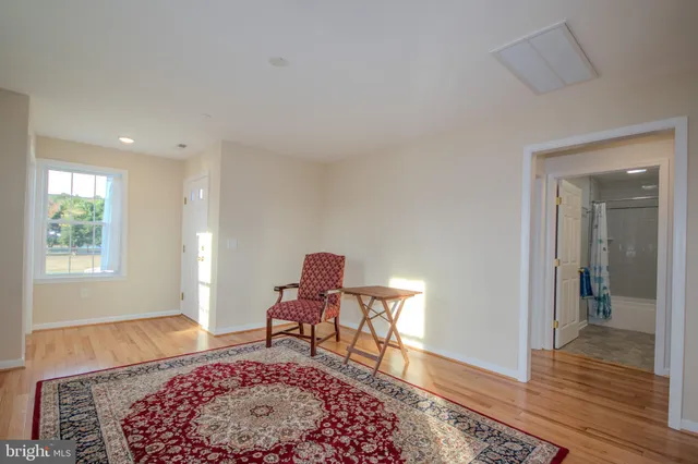 a living room with a rug and a rug