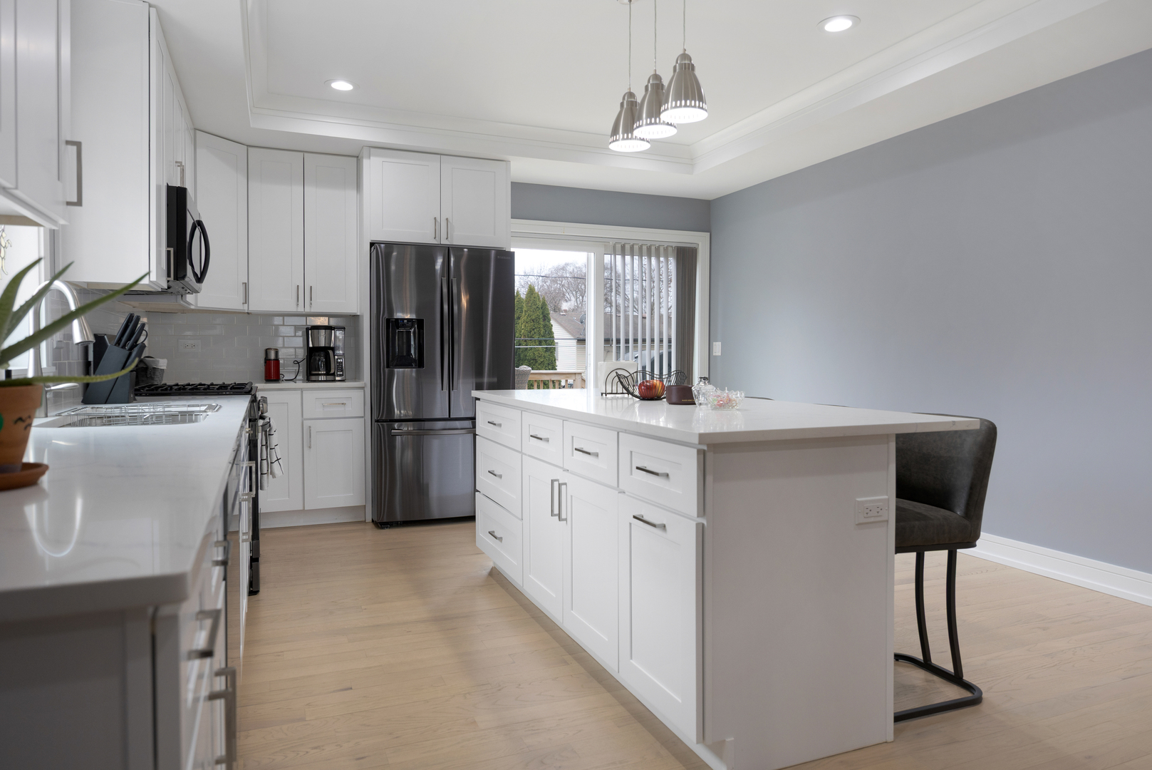 N112 Leonard Street Winfield, IL 60190 - Photo 11 of 26 a kitchen with white cabinets and stainless steel appliances