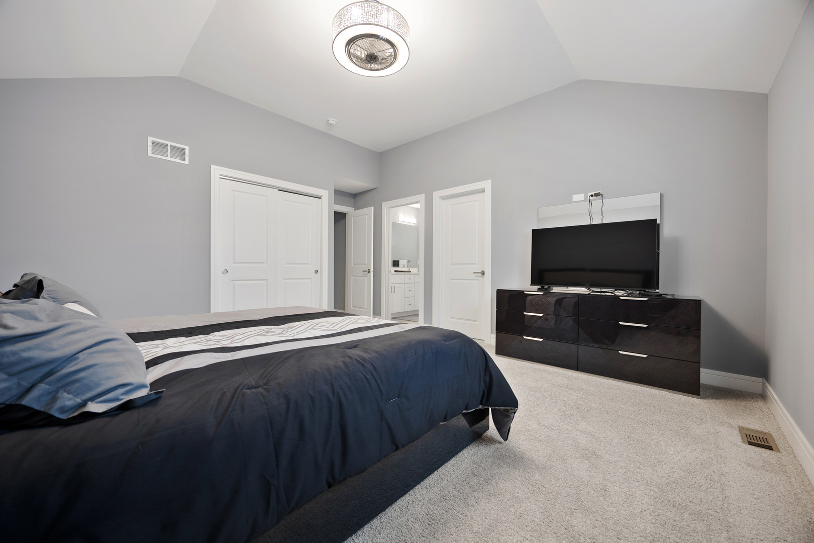 N112 Leonard Street Winfield, IL 60190 - Photo 13 of 26 a bedroom with a bed and a flat screen tv