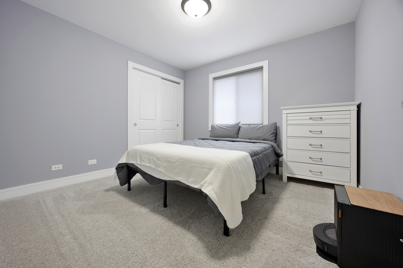 N112 Leonard Street Winfield, IL 60190 - Photo 16 of 26 a bedroom with a bed and a chair