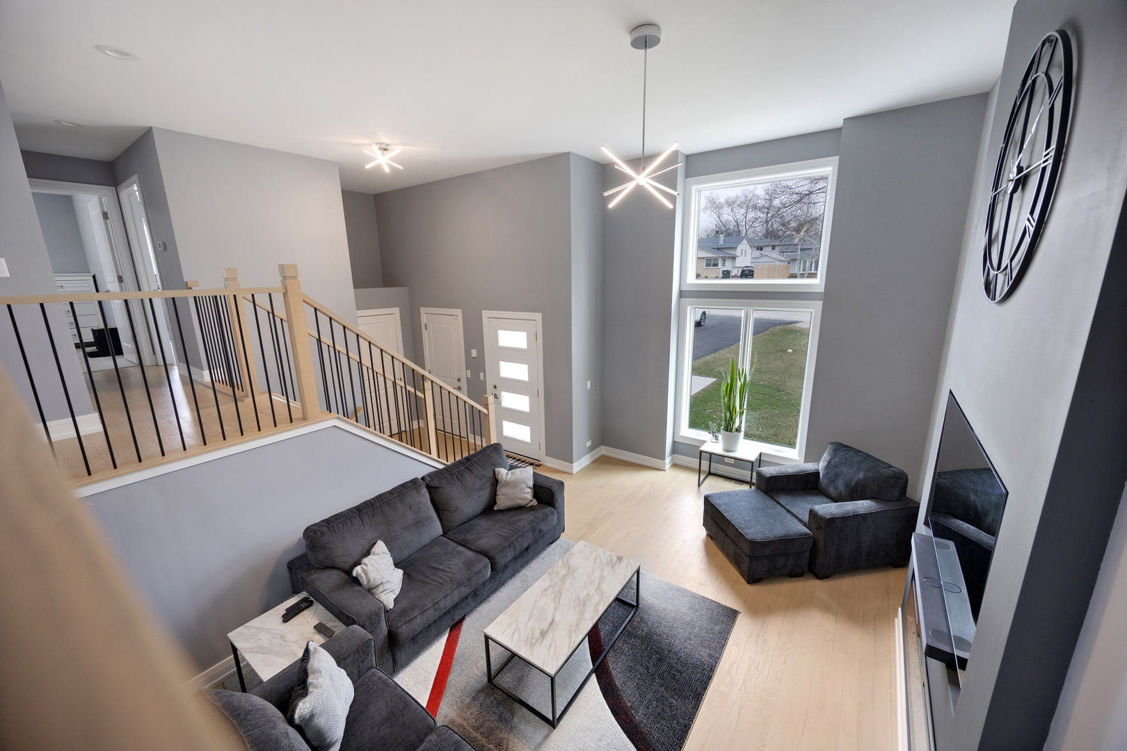 N112 Leonard Street Winfield, IL 60190 - Photo 2 of 26 a living room with furniture fireplace and a flat screen tv
