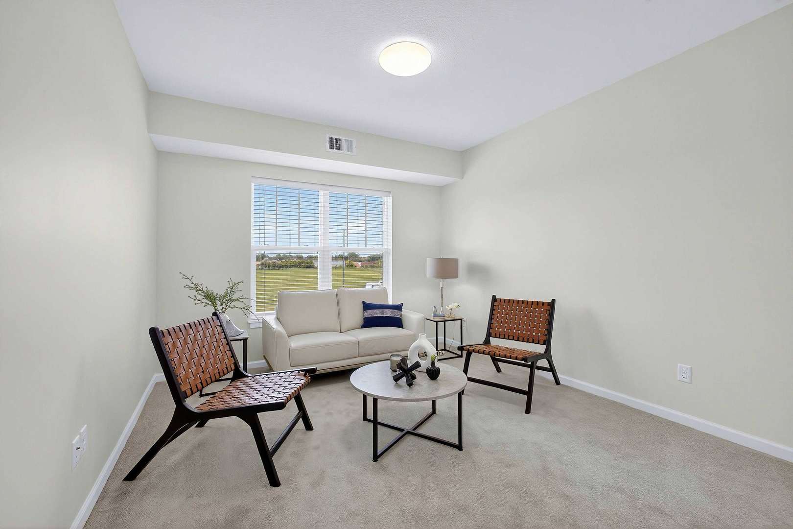 2592 Middle Road, Unit 202 Bettendorf, IA 52722 - Photo 22 of 50 a living room with furniture and a window