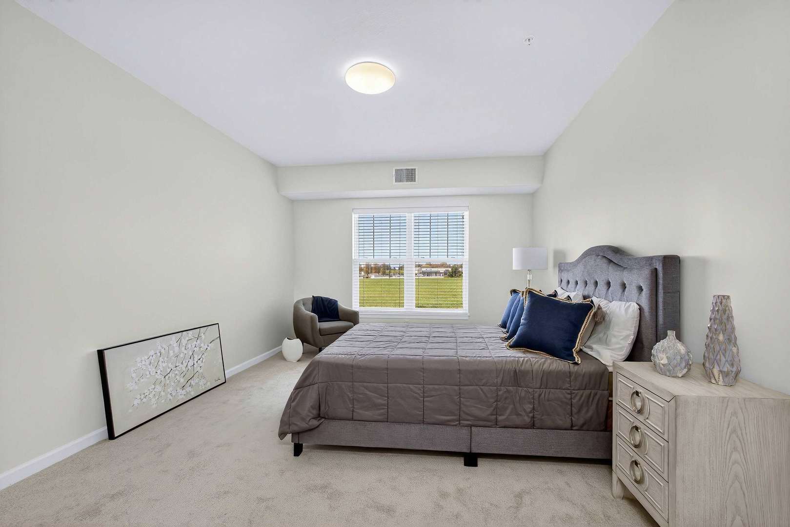 2592 Middle Road, Unit 202 Bettendorf, IA 52722 - Photo 26 of 50 a bedroom with a bed and window