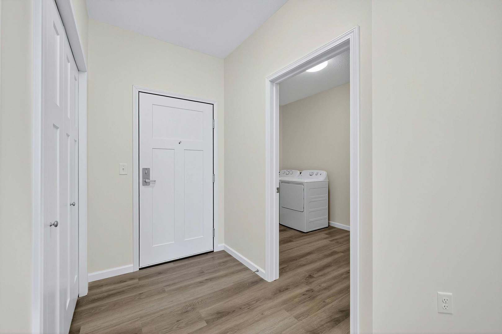 2592 Middle Road, Unit 202 Bettendorf, IA 52722 - Photo 3 of 50 a view of a room with wooden floor