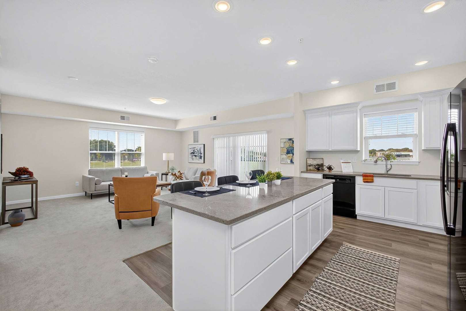 2592 Middle Road, Unit 202 Bettendorf, IA 52722 - Photo 6 of 50 a kitchen with stainless steel appliances granite countertop a stove and more cabinets