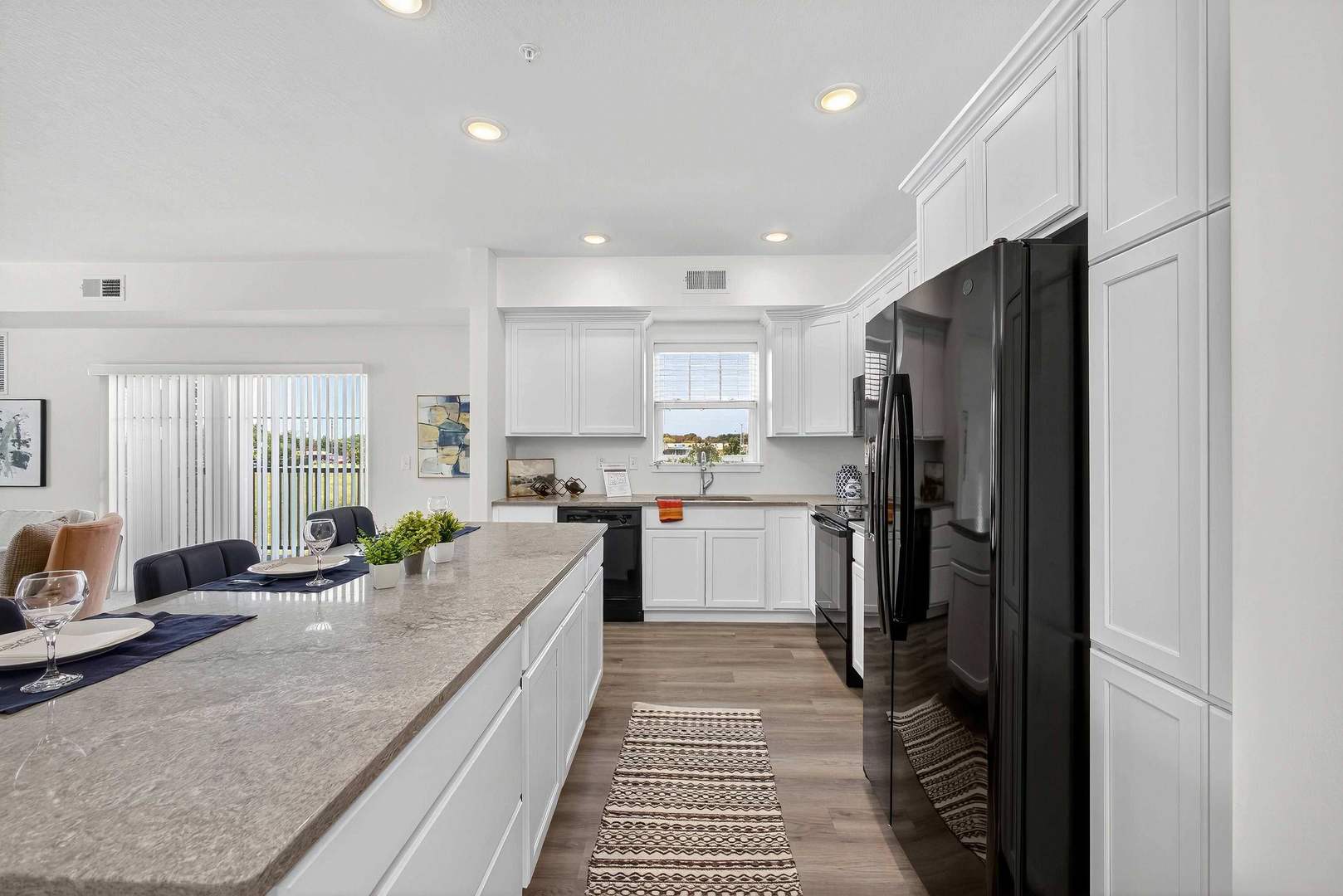2592 Middle Road, Unit 202 Bettendorf, IA 52722 - Photo 7 of 50 a kitchen with refrigerator and window