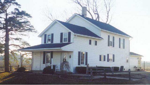 4410 North Hillcrest Road Freeport, IL 61032 - Photo 1 of 9 a front view of a house with garage