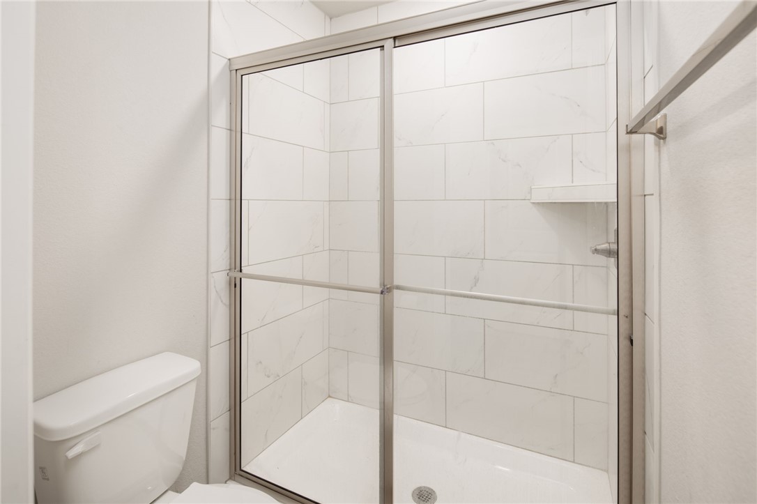 1203 High Street Navasota, TX 77868 - Photo 14 of 21 a bathroom with a shower