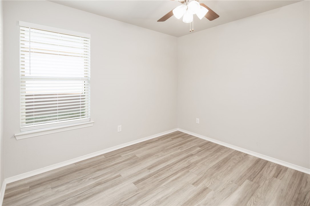 1203 High Street Navasota, TX 77868 - Photo 16 of 21 an empty room with a window