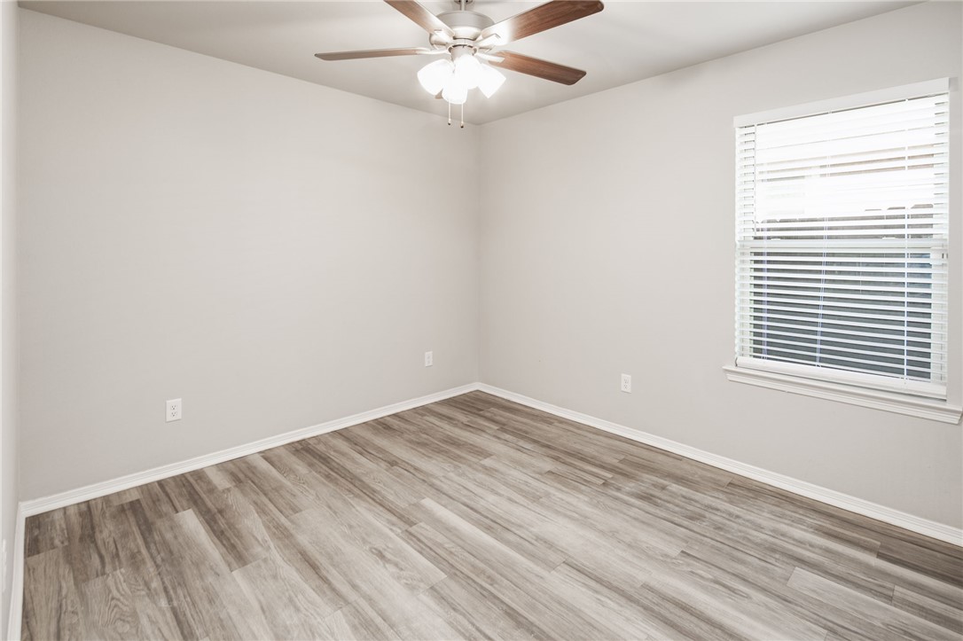 1203 High Street Navasota, TX 77868 - Photo 18 of 21 an empty room with a window and a fan