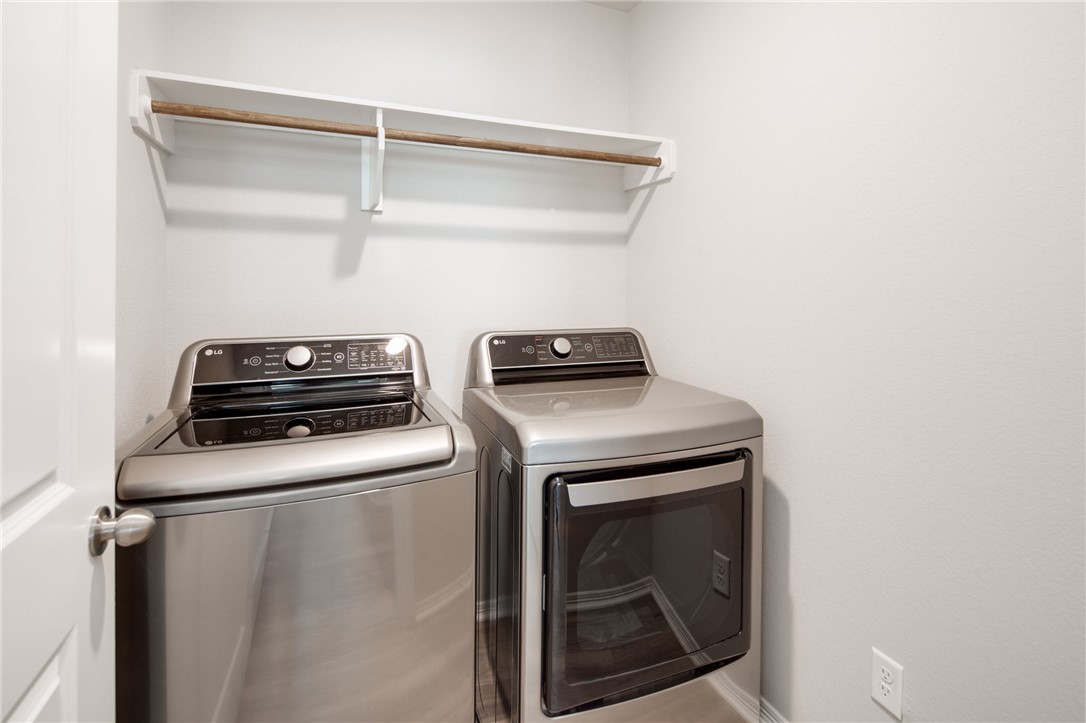 1203 High Street Navasota, TX 77868 - Photo 19 of 21 a view of storage and utility room with washer and dryer