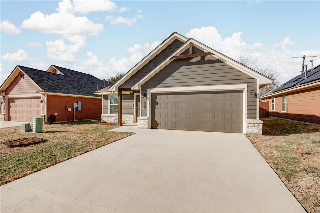 1203 High Street Navasota, TX 77868 - Photo 4 of 21 a front view of a house with a yard