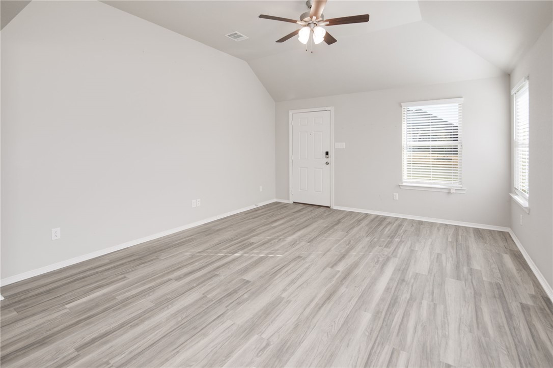 1203 High Street Navasota, TX 77868 - Photo 7 of 21 wooden floor in an empty room with a window