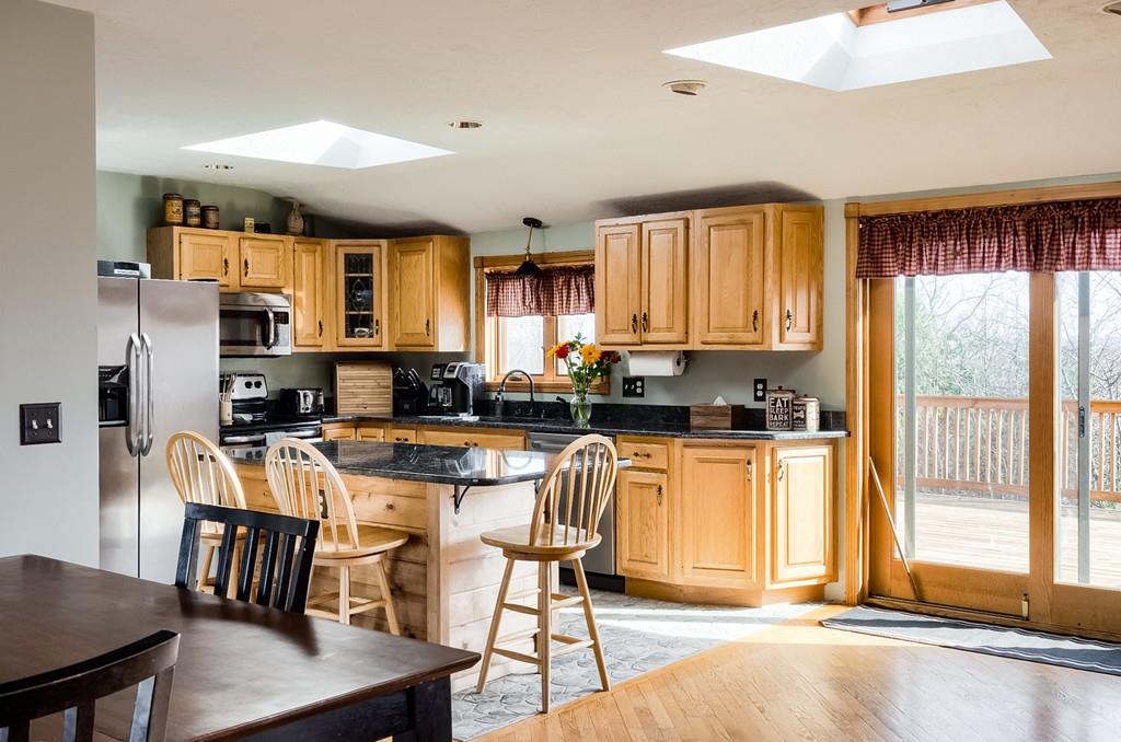 7 Mitchell Hill Road Brookfield, MA 01506 - Photo 14 of 38 a kitchen with stainless steel appliances granite countertop a stove top oven a sink dishwasher and a refrigerator